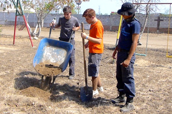 Wheelbarrow and shovelers